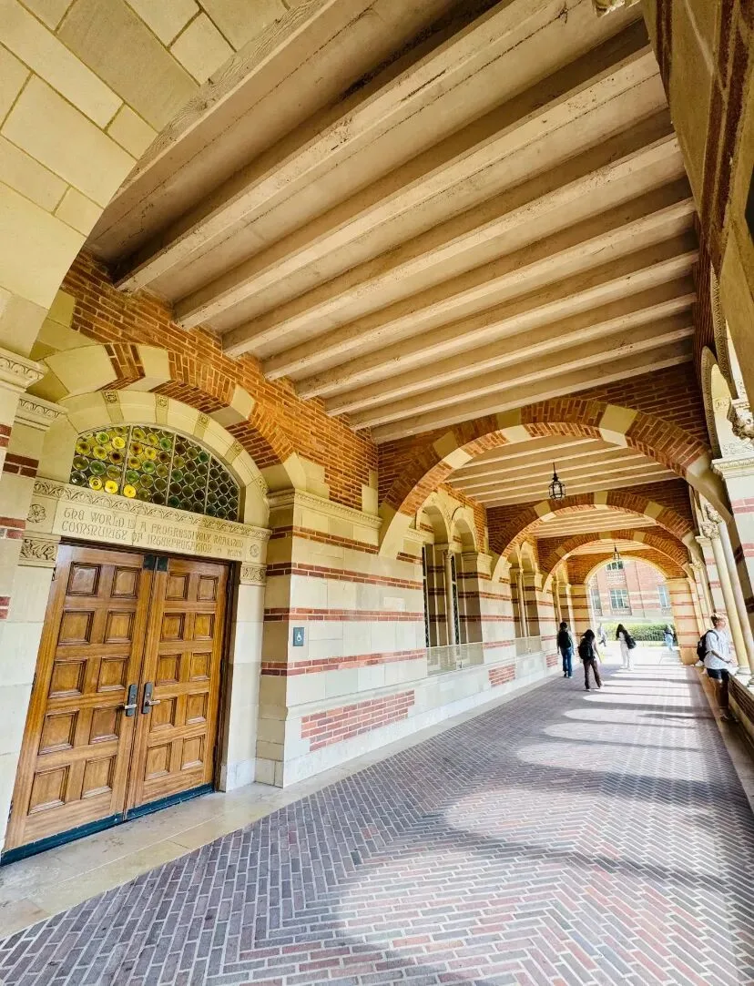 Carved above an arcade doorway: The world is a progressively realized community of interpretation.
